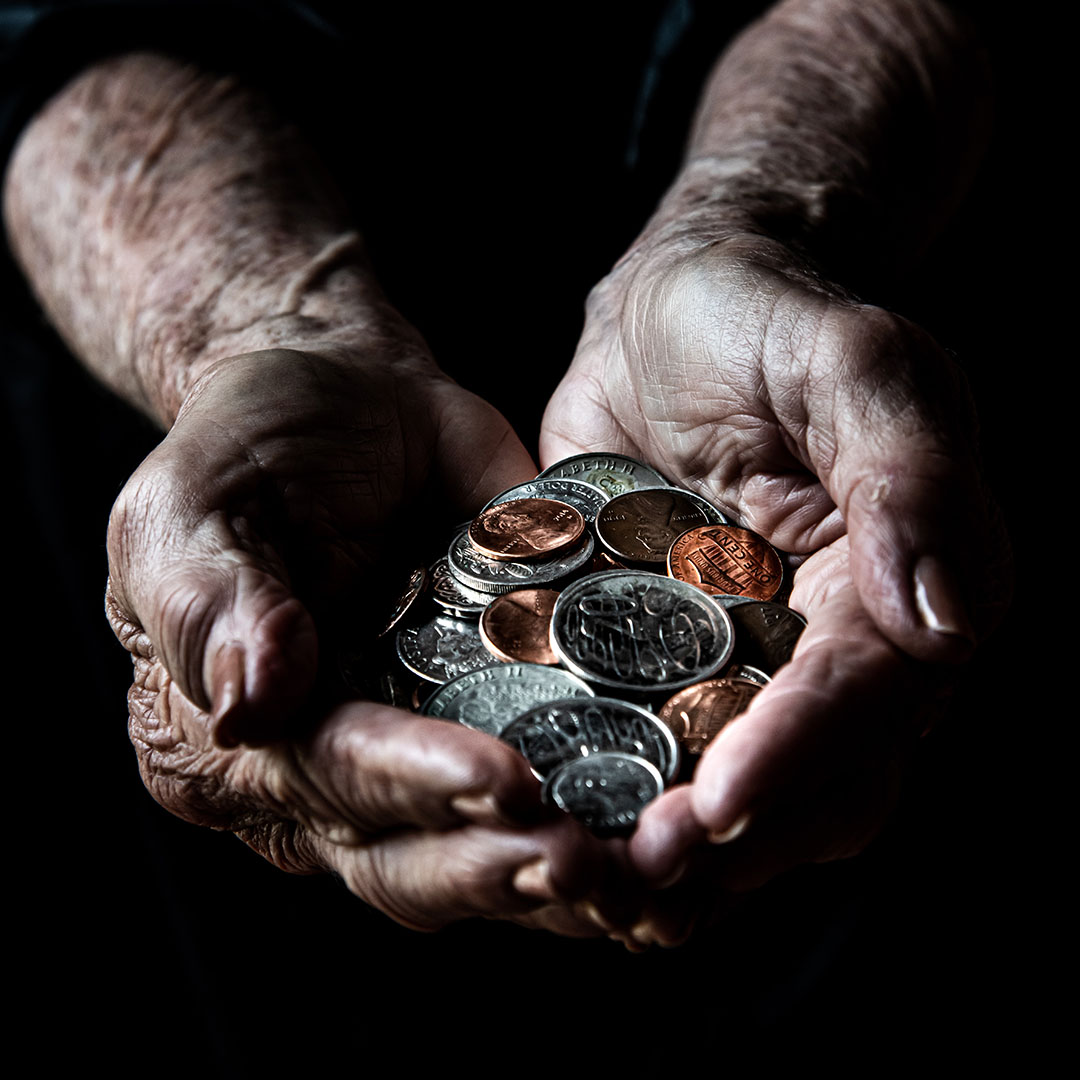 Coin collector examining rare coin