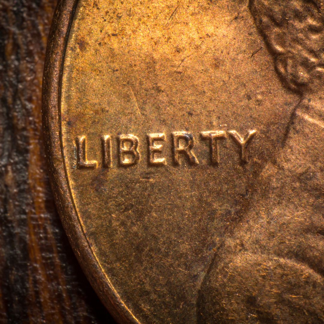 Closeup of the word "liberty" on a penny